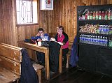 Ecuador Cotopaxi 02-09 Peter Ryan And Charlotte Ryan Inside Jose Ribas Refuge The Jos� Ribas Refuge has a large living room with a fireplace, an open dining room and a snack bar that serves delicious hot chocolate and hot tea. Peter Ryan and Charlotte Ryan had some hot tea and used the facilities before heading back down.